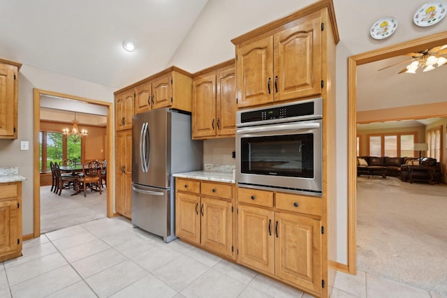 22178 Chamomile Dr, Frankfort, IL 60423 - kitchen featuring stainless steel appliances, light carpet, a chandelier, light stone countertops, and vaulted ceiling