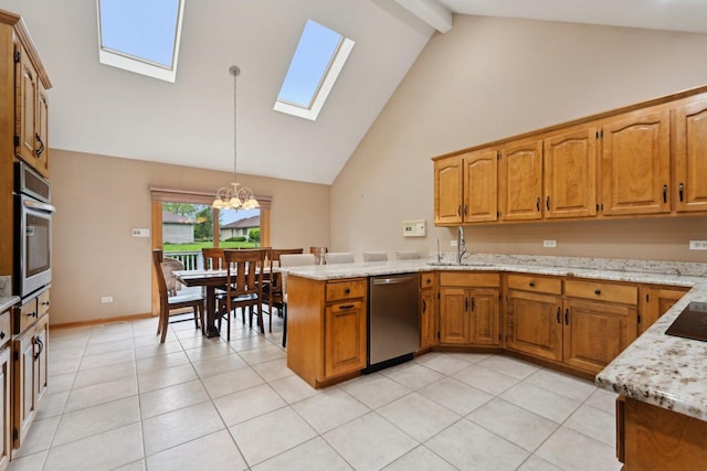 22178 Chamomile Dr, Frankfort, IL 60423 - kitchen with appliances with stainless steel finishes, a skylight, a sink, a peninsula, and high vaulted ceiling