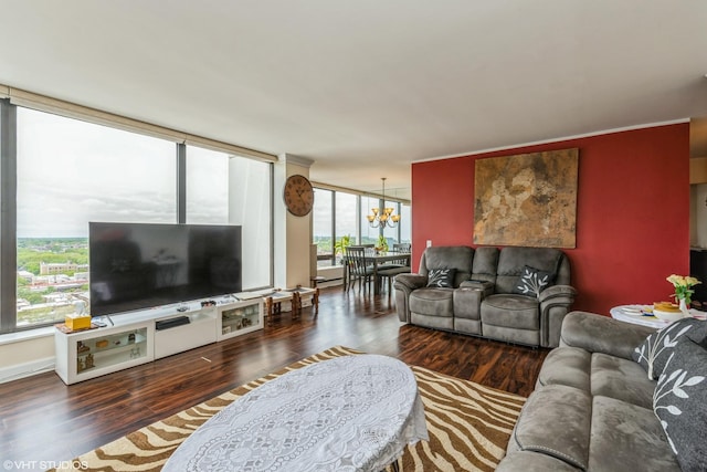 living room with a chandelier and wood finished floors