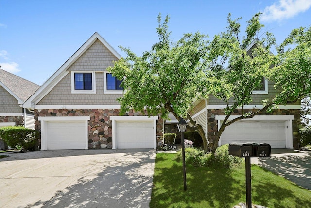 2569 Essex Dr, Northbrook, IL 60062 - view of front of house with stone siding, an attached garage, and driveway