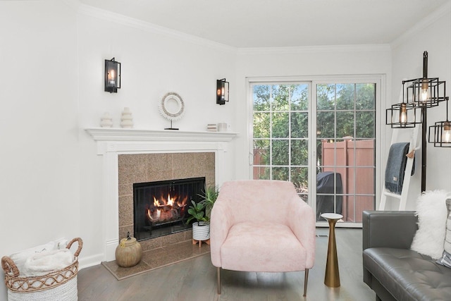 2569 Essex Dr, Northbrook, IL 60062 - sitting room featuring wood finished floors, a tiled fireplace, and crown molding