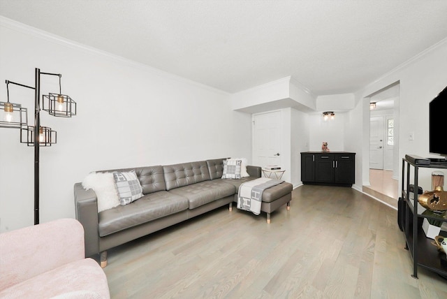 2569 Essex Dr, Northbrook, IL 60062 - living room featuring ornamental molding, light wood-type flooring, and baseboards