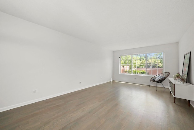 2569 Essex Dr, Northbrook, IL 60062 - unfurnished living room with wood finished floors and baseboards