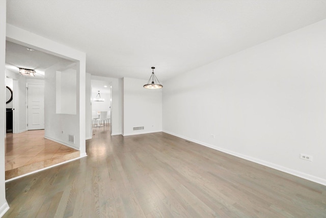 2569 Essex Dr, Northbrook, IL 60062 - unfurnished living room with wood finished floors and baseboards
