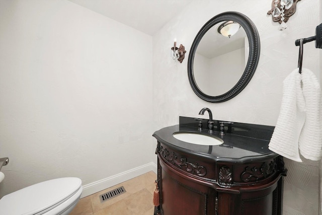 2569 Essex Dr, Northbrook, IL 60062 - half bath featuring vanity, toilet, tile patterned floors, and baseboards