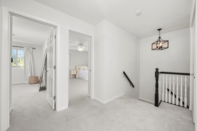 2569 Essex Dr, Northbrook, IL 60062 - hall with an upstairs landing, carpet flooring, and baseboards