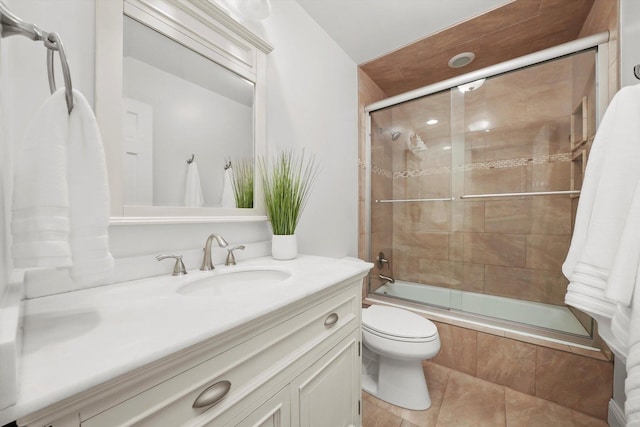 2569 Essex Dr, Northbrook, IL 60062 - full bathroom featuring tiled shower / bath, vanity, toilet, and tile patterned flooring