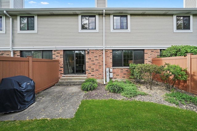 2569 Essex Dr, Northbrook, IL 60062 - rear view of property featuring brick siding and a chimney