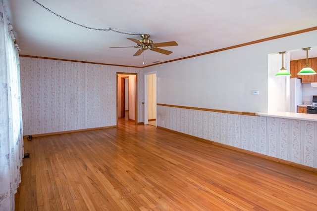 1700 W William St, Champaign, IL 61821 - unfurnished room featuring ceiling fan, light wood-style flooring, wallpapered walls, and ornamental molding