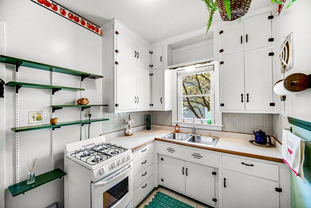 629 S Union St, Aurora, IL 60505 - kitchen featuring white gas range, a sink, open shelves, and white cabinets