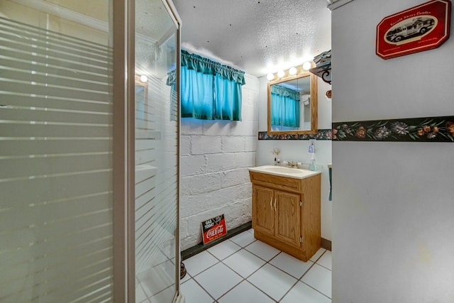 629 S Union St, Aurora, IL 60505 - bathroom featuring tile patterned floors, vanity, and a textured ceiling