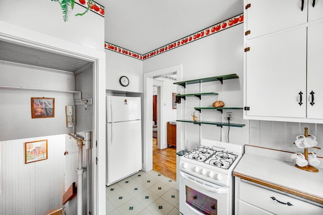 629 S Union St, Aurora, IL 60505 - kitchen with white appliances, open shelves, white cabinetry, and light countertops