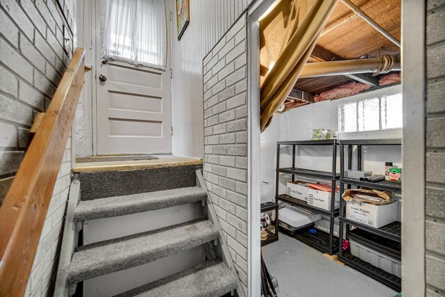629 S Union St, Aurora, IL 60505 - stairway featuring concrete block wall and concrete flooring