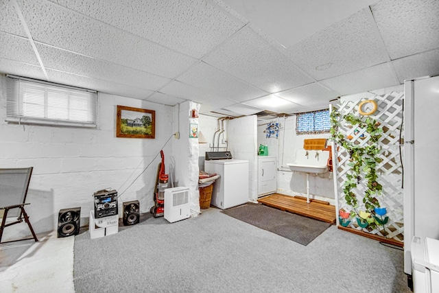 629 S Union St, Aurora, IL 60505 - below grade area with washing machine and clothes dryer, a drop ceiling, concrete block wall, carpet, and a sink