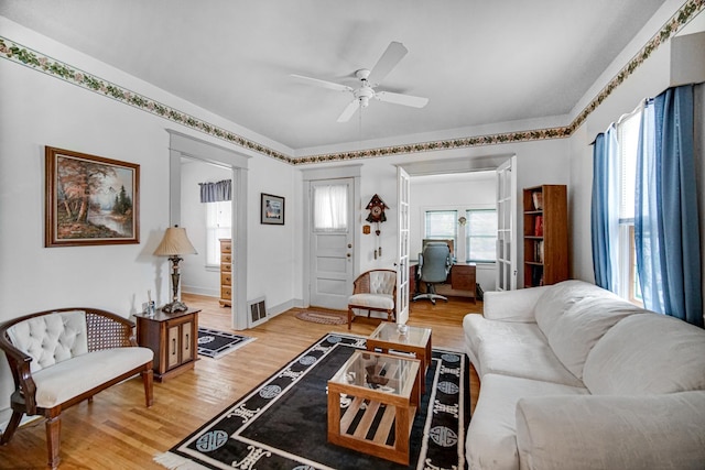 629 S Union St, Aurora, IL 60505 - living area with ceiling fan, light wood-style floors, and baseboards