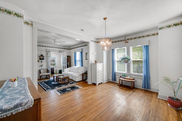 629 S Union St, Aurora, IL 60505 - living area featuring wood finished floors, a chandelier, baseboards, and ceiling fan