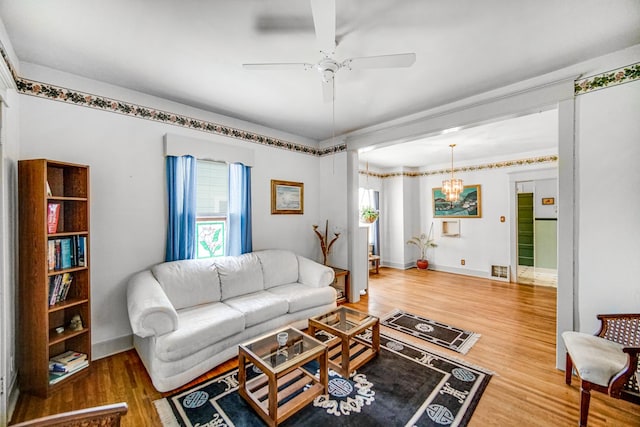 629 S Union St, Aurora, IL 60505 - living area featuring wood finished floors, a ceiling fan, and baseboards