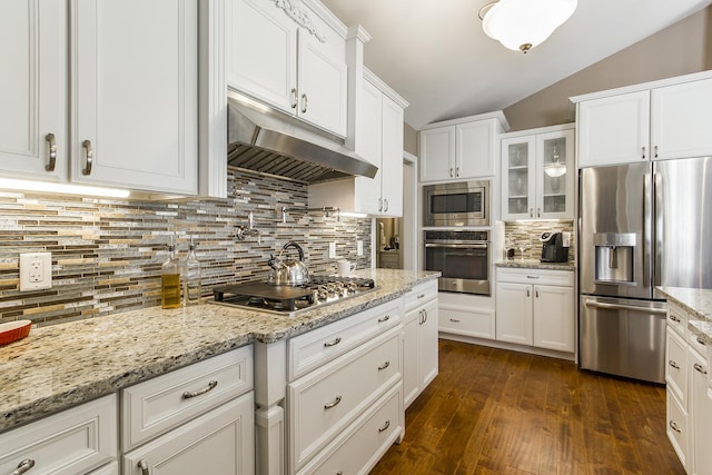 2164 Waterbury Ln W Unit 2164, Sycamore, IL 60178 - kitchen featuring stainless steel appliances, under cabinet range hood, vaulted ceiling, white cabinetry, and tasteful backsplash