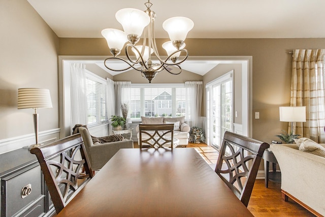 2164 Waterbury Ln W Unit 2164, Sycamore, IL 60178 - dining room with a chandelier, vaulted ceiling, and wood finished floors