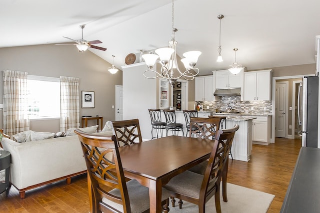 2164 Waterbury Ln W Unit 2164, Sycamore, IL 60178 - dining room featuring ceiling fan, wood finished floors, a chandelier, and high vaulted ceiling