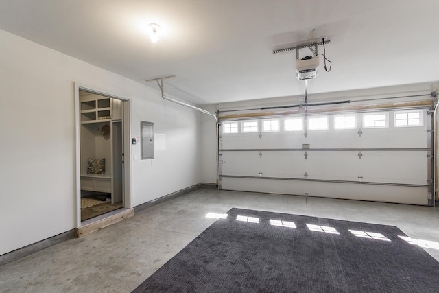 2164 Waterbury Ln W Unit 2164, Sycamore, IL 60178 - garage with electric panel, baseboards, and a garage door opener