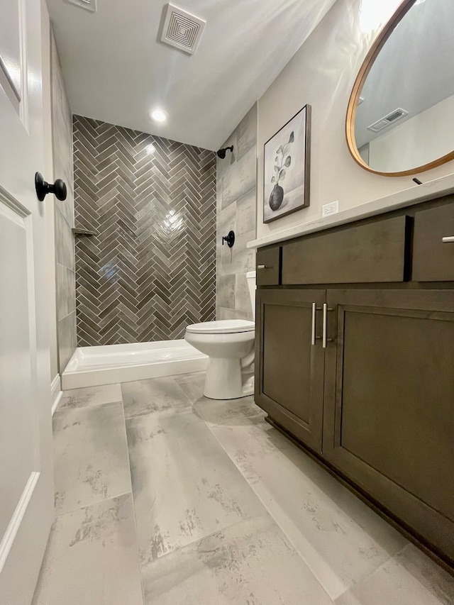 LOTT315929 Prairie View Ct, New Lenox, IL 60451 - bathroom with marble look tile flooring, toilet, vanity, tiled shower, and tile walls