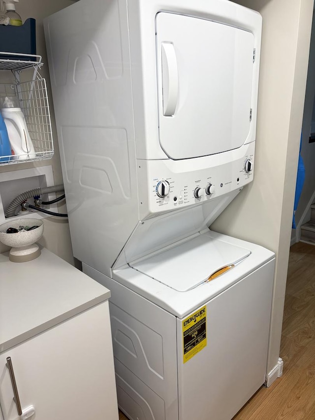 1487 Kathleen Way, Elk Grove Village, IL 60007 - laundry room with stacked washing machine and dryer and light wood-type flooring