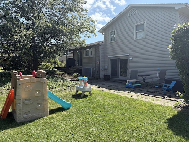 1487 Kathleen Way, Elk Grove Village, IL 60007 - back of property with a yard, a patio, and a playground