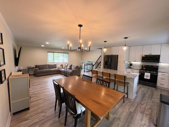 1487 Kathleen Way, Elk Grove Village, IL 60007 - dining space featuring wood finished floors and a chandelier