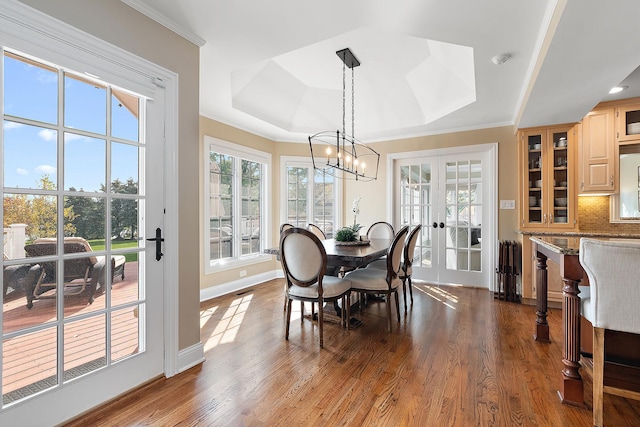 12000 W Donegal Ln, New Lenox, IL 60451 - dining room with a tray ceiling, healthy amount of natural light, a chandelier, dark wood finished floors, and crown molding