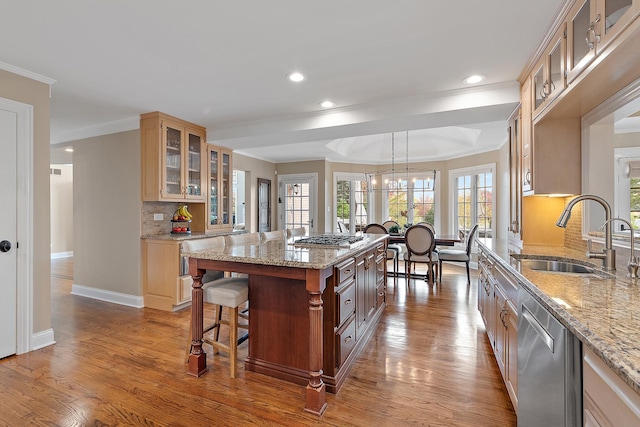 12000 W Donegal Ln, New Lenox, IL 60451 - kitchen featuring appliances with stainless steel finishes, wood finished floors, decorative backsplash, crown molding, and a chandelier