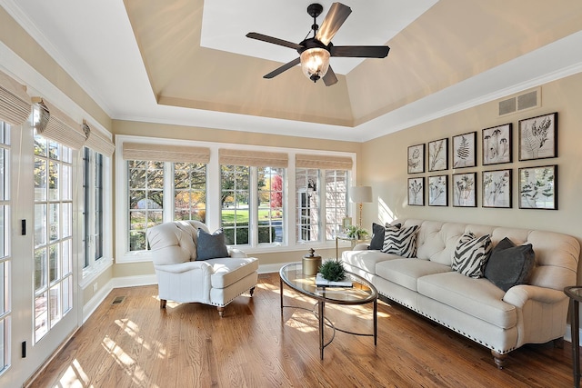 12000 W Donegal Ln, New Lenox, IL 60451 - living room with a raised ceiling, healthy amount of natural light, a ceiling fan, and crown molding