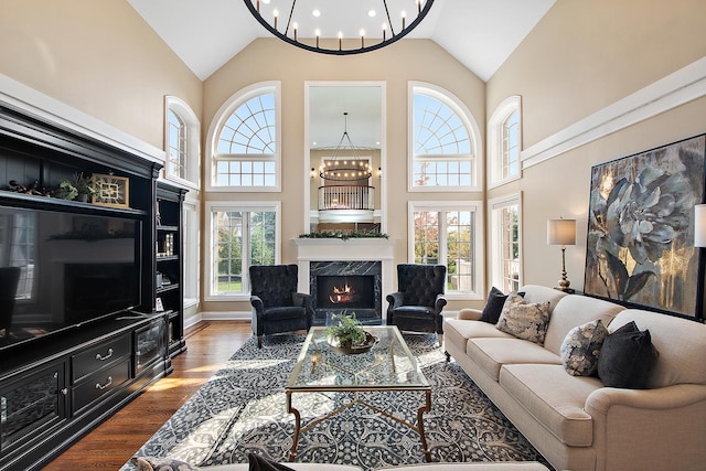 12000 W Donegal Ln, New Lenox, IL 60451 - living room with a chandelier, high vaulted ceiling, a high end fireplace, and wood finished floors