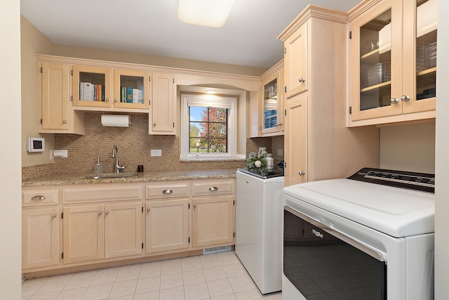 12000 W Donegal Ln, New Lenox, IL 60451 - laundry area with cabinet space, washer and dryer, and light tile patterned flooring