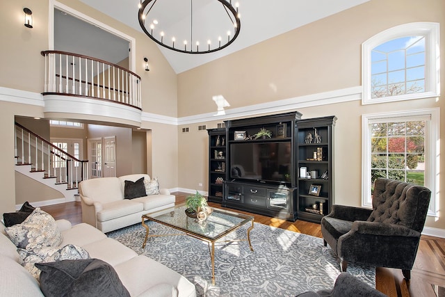 12000 W Donegal Ln, New Lenox, IL 60451 - living area with high vaulted ceiling, a chandelier, stairs, and wood finished floors