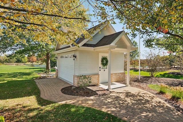 12000 W Donegal Ln, New Lenox, IL 60451 - view of outdoor structure with an attached garage and a water view