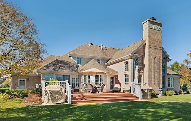 12000 W Donegal Ln, New Lenox, IL 60451 - back of property with a lawn, a wooden deck, a chimney, and brick siding
