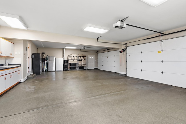 12000 W Donegal Ln, New Lenox, IL 60451 - garage featuring freestanding refrigerator and a garage door opener