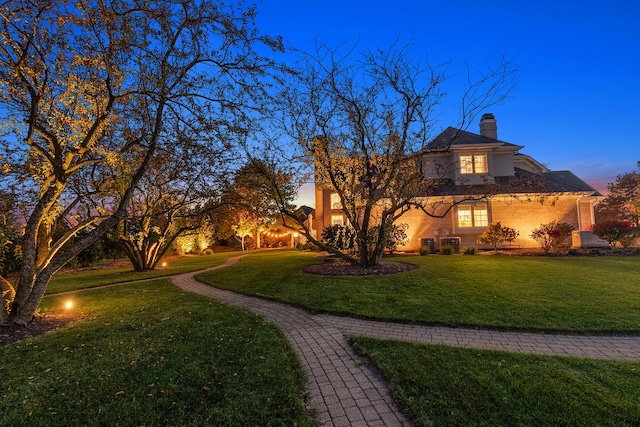 12000 W Donegal Ln, New Lenox, IL 60451 - view of front of house with a yard and a chimney