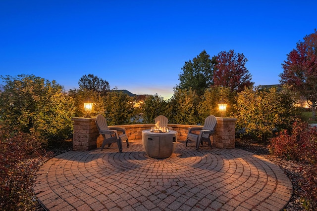 12000 W Donegal Ln, New Lenox, IL 60451 - patio terrace at dusk featuring a fire pit and a patio area