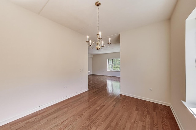 200 N Addison Ave Unit 306, Elmhurst, IL 60126 - spare room with a chandelier, light wood-style flooring, and baseboards