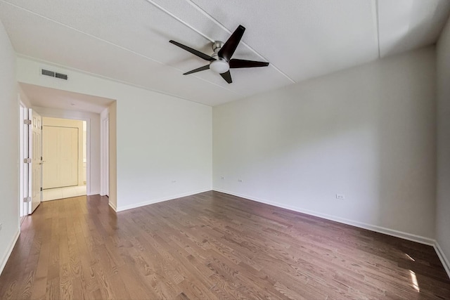 200 N Addison Ave Unit 306, Elmhurst, IL 60126 - spare room featuring wood finished floors, a ceiling fan, and baseboards