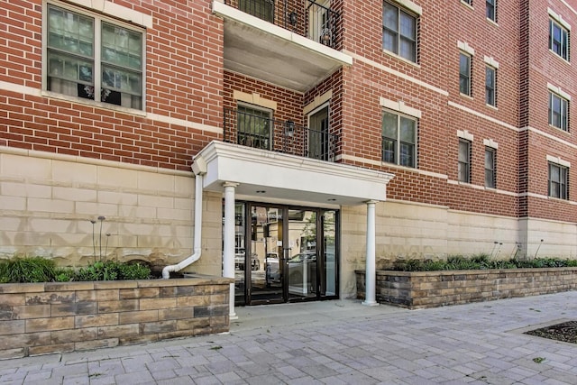 200 N Addison Ave Unit 306, Elmhurst, IL 60126 - doorway to property with brick siding and a balcony