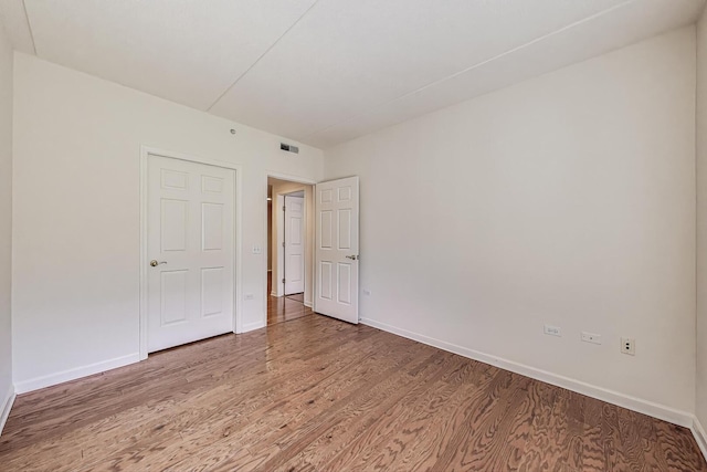 200 N Addison Ave Unit 306, Elmhurst, IL 60126 - unfurnished bedroom featuring light wood finished floors and baseboards