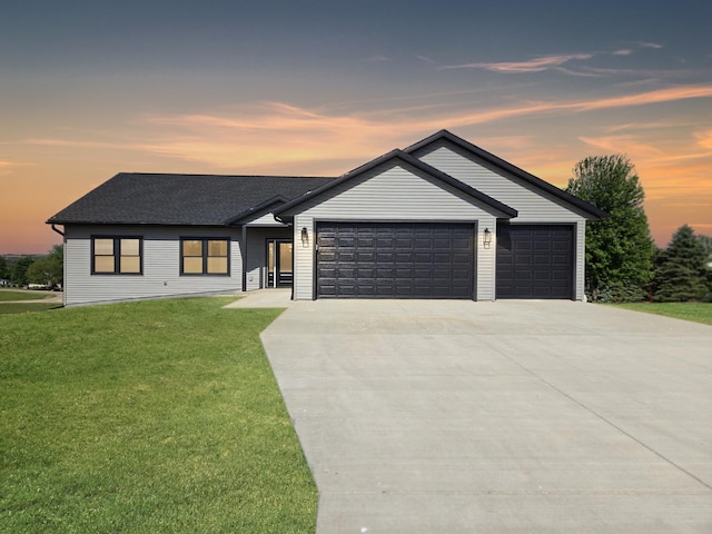17-95 Lake Carroll Blvd, Lake Carroll, IL 61046 - view of front of property featuring a garage, concrete driveway, a yard, and a shingled roof