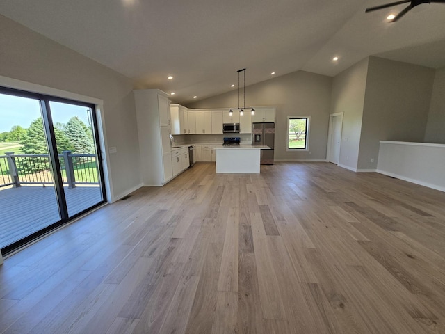17-95 Lake Carroll Blvd, Lake Carroll, IL 61046 - unfurnished living room with light wood-type flooring, lofted ceiling, baseboards, and recessed lighting