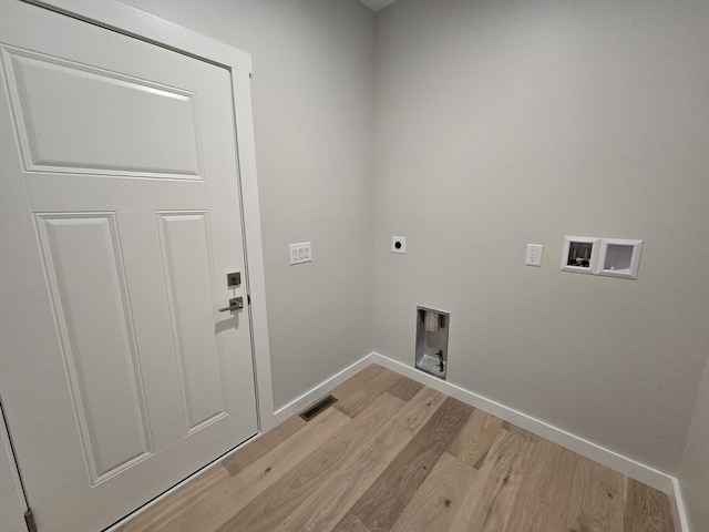 17-95 Lake Carroll Blvd, Lake Carroll, IL 61046 - laundry room featuring electric dryer hookup, light wood-style floors, hookup for a washing machine, and baseboards