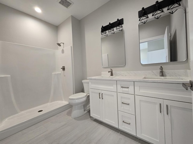 17-95 Lake Carroll Blvd, Lake Carroll, IL 61046 - bathroom with toilet, double vanity, a shower, wood finished floors, and recessed lighting