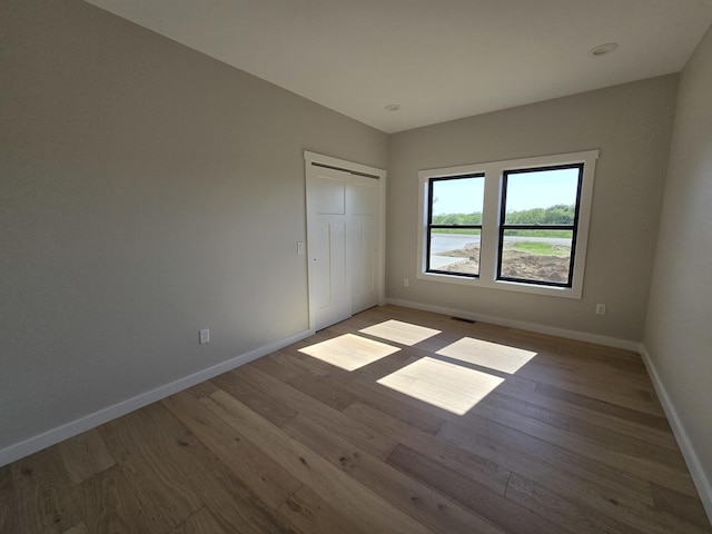 17-95 Lake Carroll Blvd, Lake Carroll, IL 61046 - unfurnished bedroom with wood finished floors, baseboards, and a closet