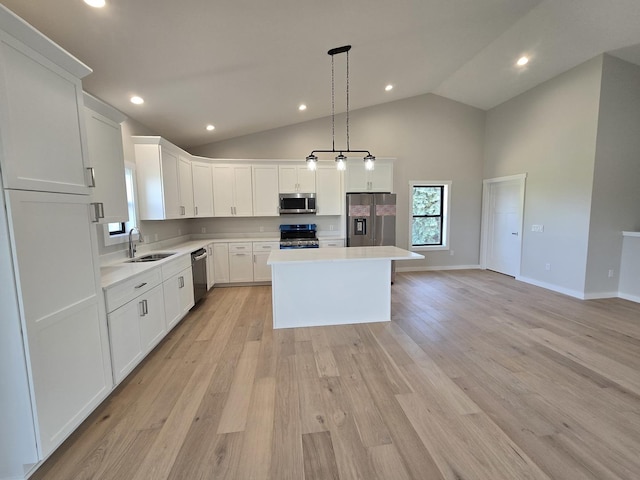 17-95 Lake Carroll Blvd, Lake Carroll, IL 61046 - kitchen with appliances with stainless steel finishes, a sink, a center island, light countertops, and white cabinets